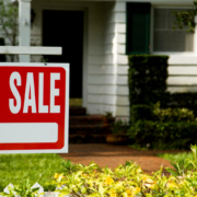 For sale sign outside a family house